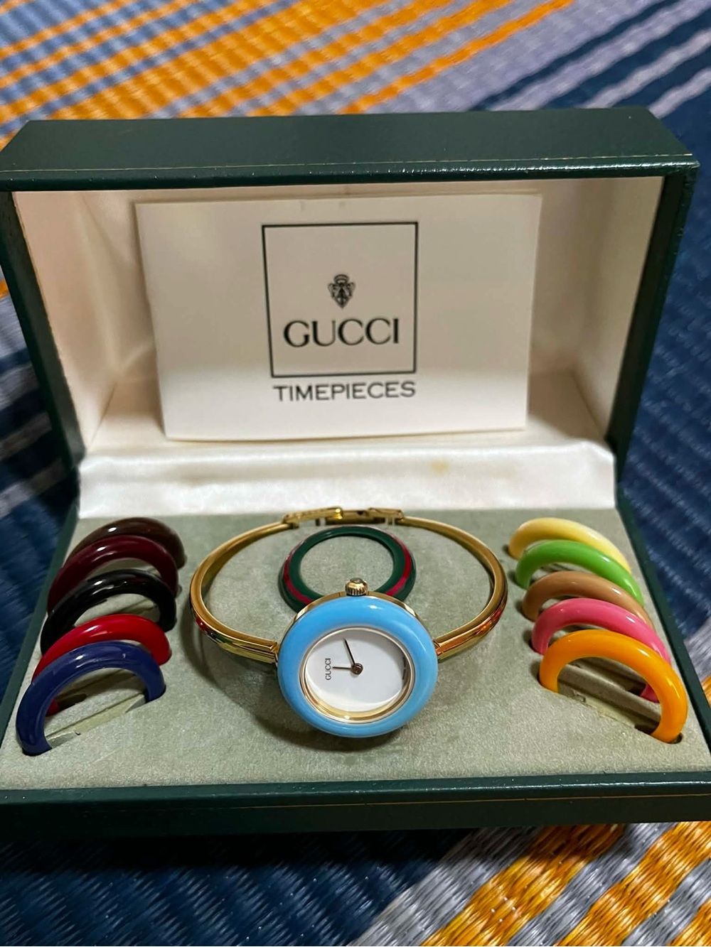 Gucci Gold Bangle Watch with Interchangeable Colored Bezels - Light Blue